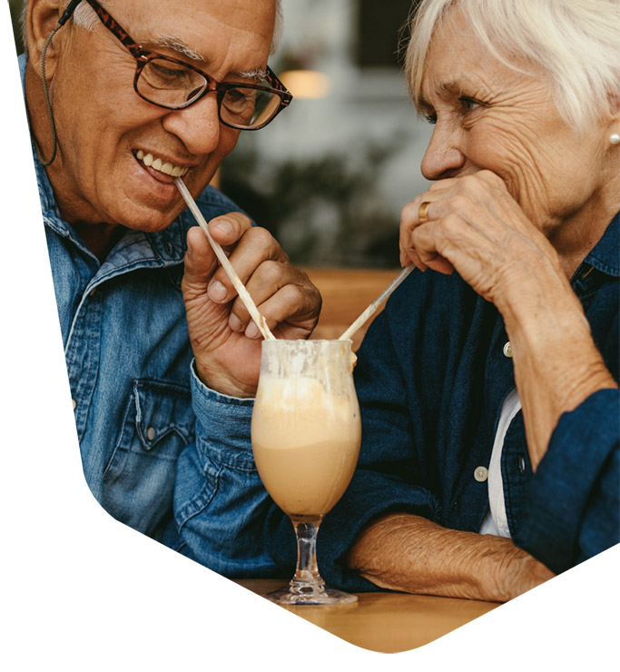 Senior couple sharing a beverage